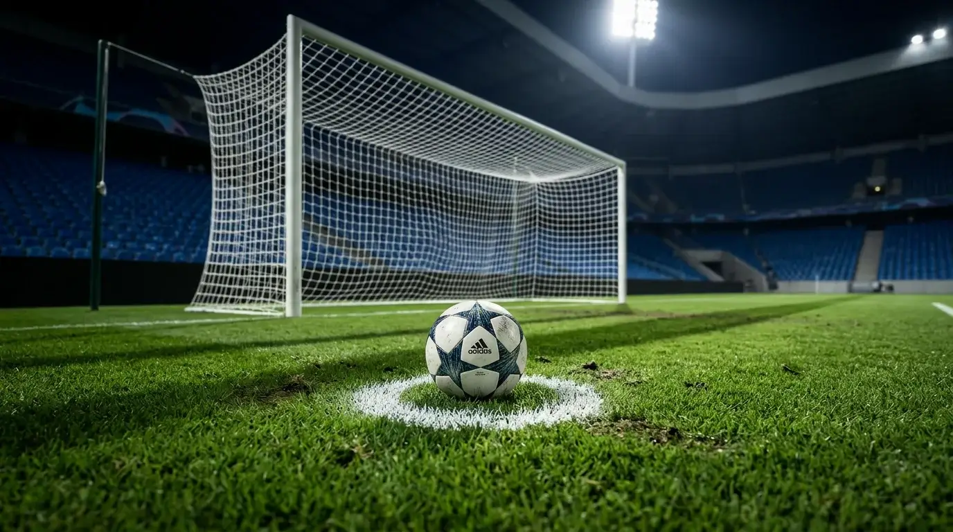 Balon de futbol junto a un marcador con estadisticas de goles en un estadio europeo